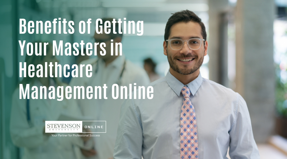 Image of a professionally dressed man wearing glasses with medical staff in the background and text saying Benefits of Getting Your Masters in Healthcare Management Online