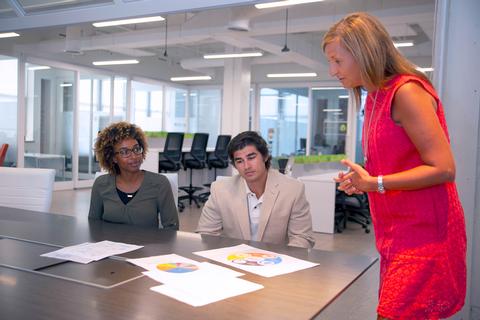 Woman leads meeting