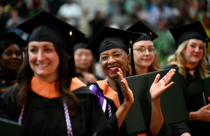 students in graduation cap and gowns